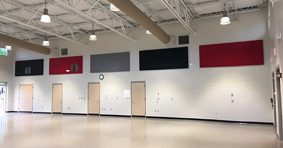 MBI Spectrum acoustical ceiling panels installed in black, grey, and red