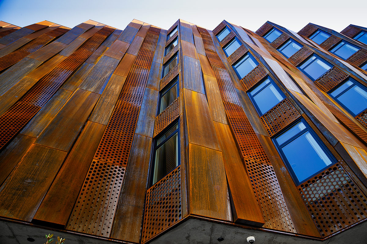 Closeup of abstract, rusted metal facade and cladding for commercial building