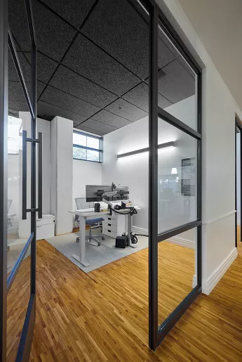 Tectum Tegular Ceiling Panels installed in a corporate office in the color black